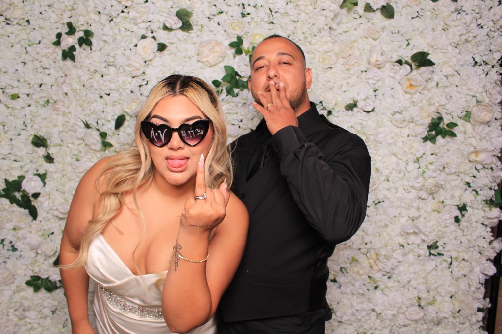 Las Vegas wedding photo booth with flower wall backdrop - Let Me Shine Events
