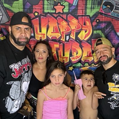 Family birthday party photo booth with graffiti backdrop in Las Vegas