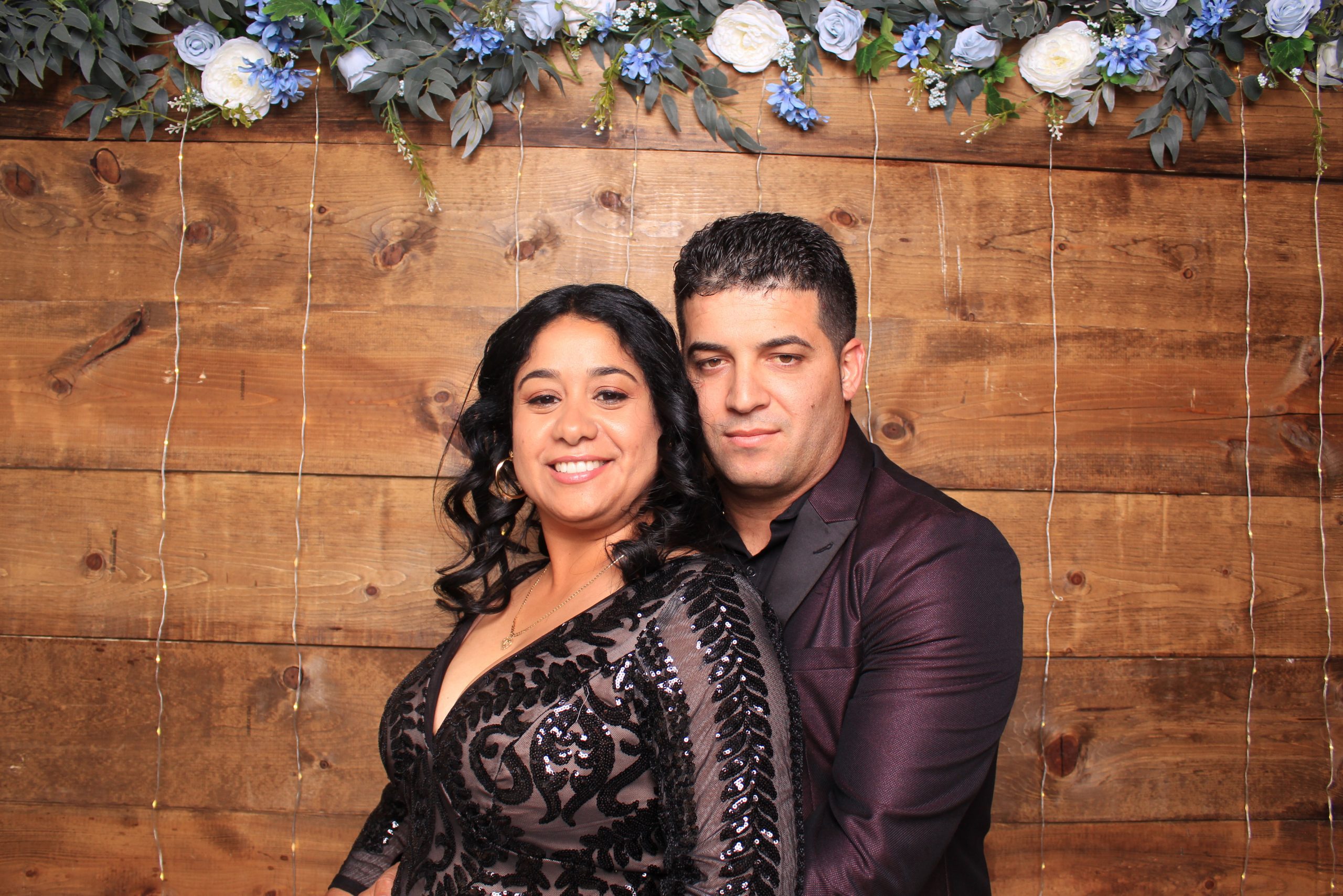 Wedding couple with rustic backdrop at a Las Vegas photo booth