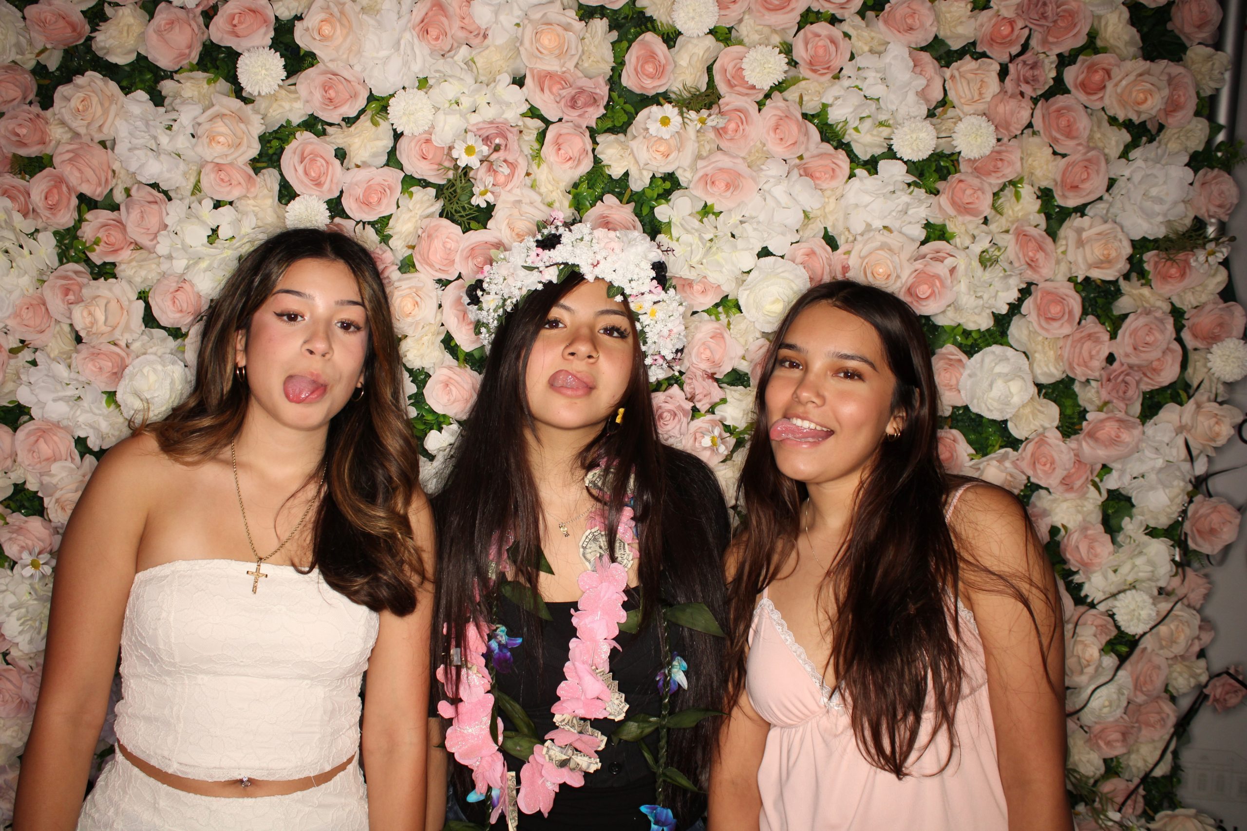 Graduation photo booth with flower wall backdrop in Las Vegas